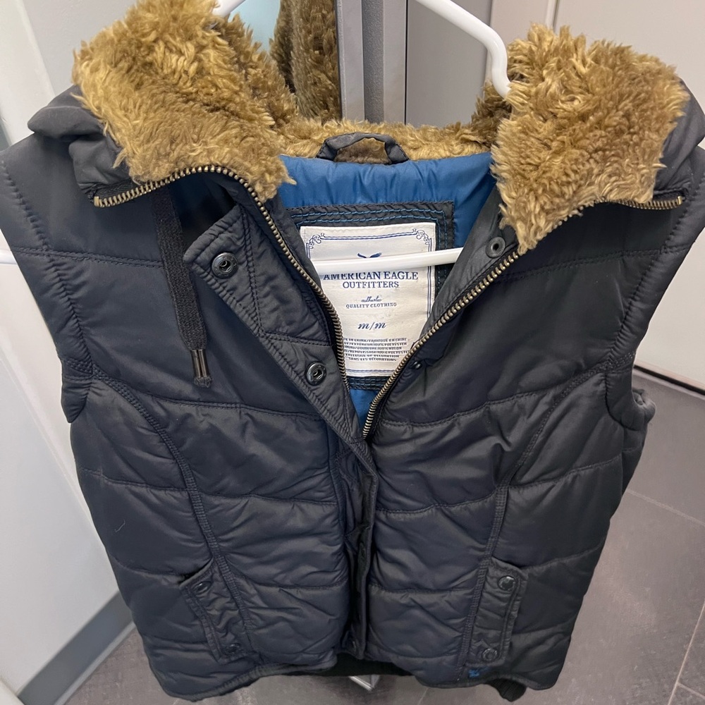 Black vest with a fur hood